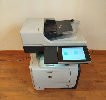 Принтеры: Скоростной двухсторонний принтер, сканер, копир. HP M525