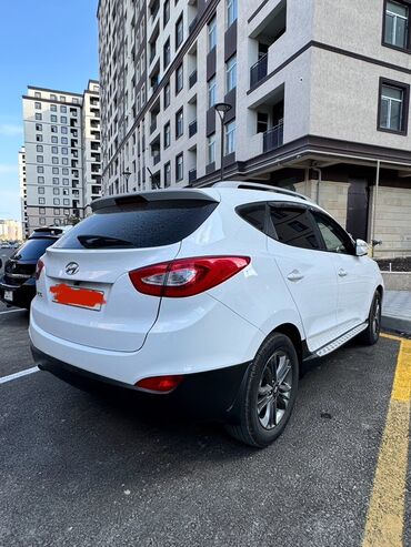 Yağlar və avtokimyəvi maddələr: Hyundai ix35, ağ rəngli, şəhər və uzun yol üçün rahat krossover