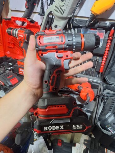 шуруповерт rodex: Ударная дрель-шуруповерт Rodex с эргономичным корпусом красного и
