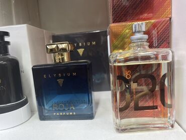 анальные игрушки: Элегантный парфюм Elysium Roja Parfums во флаконе темно-синего оттенка