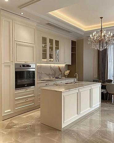 Кухонные гарнитуры: Кухонный гарнитур в современном стиле, выполненный в светлых тонах. Он — 7