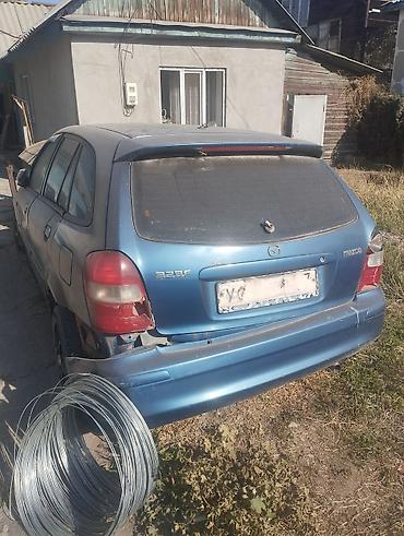 е 34 тарпеда сидения: Mazda 323: 2001 г., 1.6 л, Механика, Бензин, Универсал — 4