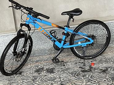 trinx carbon: Горный велосипед TRINX M136 в ярком голубом цвете с оранжевыми — 2