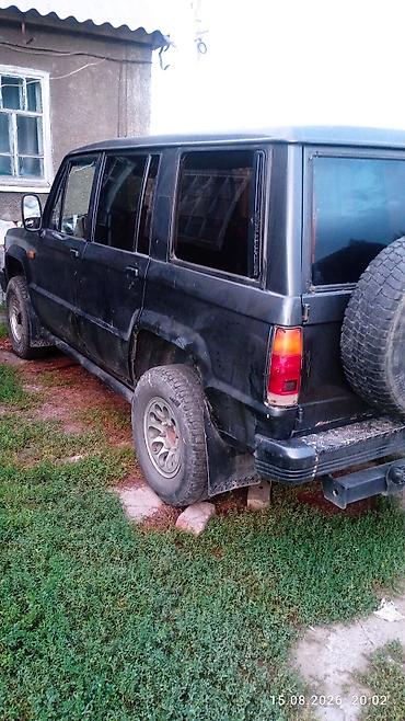 тунуке бу: Isuzu Trooper: 1991 г., 2.3 л, Кол менен иштөөчү, Дизель, Жол тандабас — 6