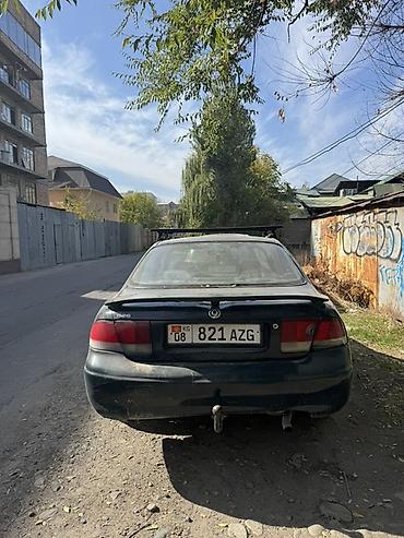 выхлоп на 210: Mazda 626: 1995 г., 1.8 л, Механика, Бензин, Седан — 4