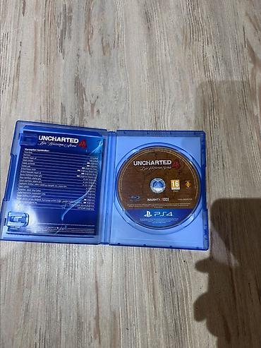 Видеоигры и приставки: Məhsul: Uncharted 4: A Thief’s End – PS4 (Blu‑ray disk, rəsmi qutu) — 1