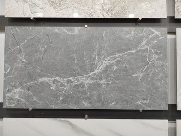 aqlay dasi: Boz mərmər effektli keramika plitə - Rəng: tünd-boz əsas, incə ağ