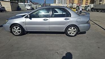 duman fara: Mitsubishi Lancer: 1.6 l | 2006 il 466000 km Sedan — 1