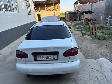 мотор нексия 1: Daewoo Lanos: 1999 г., Седан — 2