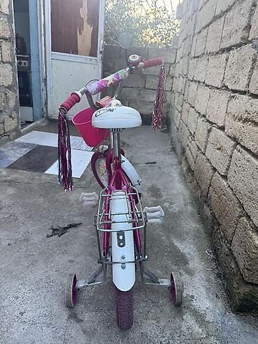 velosiped sin: Uşaq velosipedi – qızlar üçün, çəhrayı rəngdə Xüsusiyyətlər: - Təkər — 4