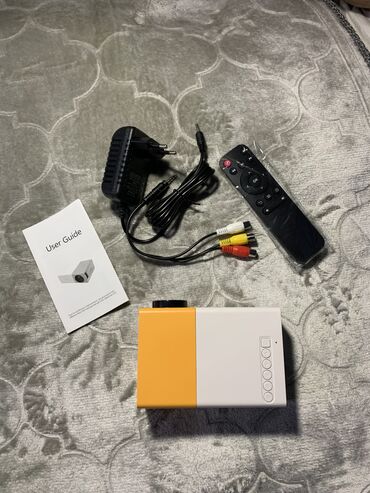 микрофон hoco: Mini Projector YG 300 считается одним из лучших портативных проекторов