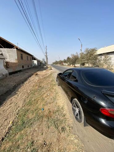 авто спорт: Купе спортивного стиля, черный цвет. Кузов с аэродинамическим