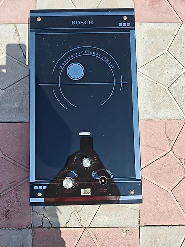BOSCH markalı qazla işləyən su qızdırıcısı (divar tipli, şüşə ön