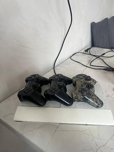 PS3 (Sony PlayStation 3): PlayStation 3 Super Slim (белая) Комплект: - Консоль PS3 Super Slim — 12