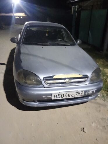 деу лонос: Автомобиль Chevrolet Lanos в кузове седан, выполненный в светло-сером