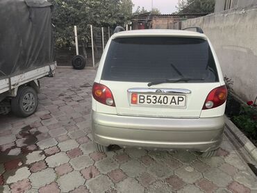 газовое оборудование на зил: Автомобиль Daewoo Matiz белого цвета с бежевыми бамперами. Компактный