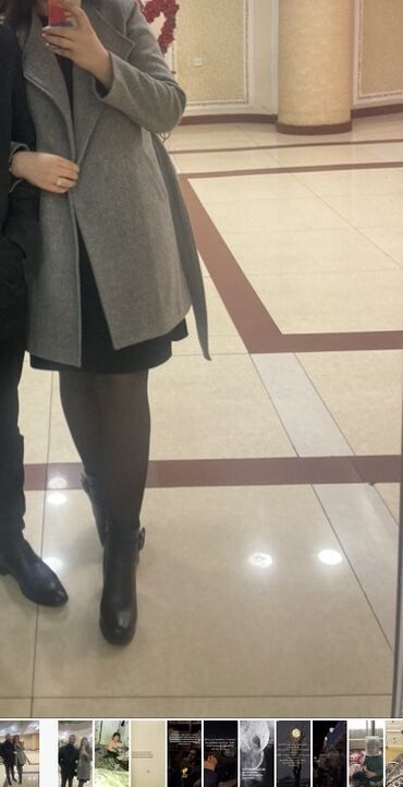 qaqa geyimi: Zərif boz rəngdə qadın palto. Bu palto rahat kəsimi və kəmərli