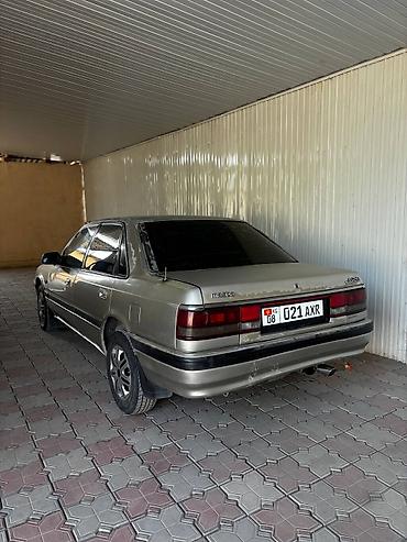 трос багажника камри 30: Mazda 626: 1991 г., 2 л, Механика, Бензин, Седан — 4