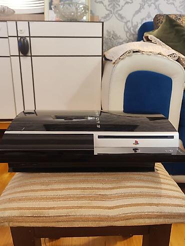 PlayStation 3 “Fat” (orijinal korpus, qara, ön paneldə gümüş zolaq) lalafo.az -da PlayStation 3 “Fat” (orijinal korpus, qara, ön paneldə gümüş zolaq)