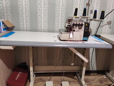 распошивальная швейная машина: Тигүүчү машина Оверлок