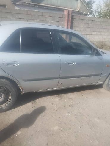 Mazda 323: 1997 г., 1.8 л, Механика, Бензин, Седан