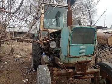 Дисктүү малалар: Трактор колёсный с кабиной + навесной 3-корпусный плуг - Кабина — 5