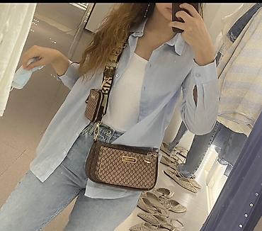 Açıq mavi rengde rubaşka. Türkiyeden H&m den alınıb, eynisinin ağı