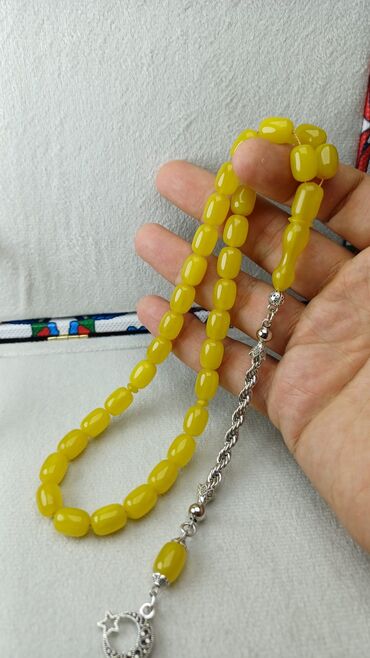 Təsbehlər: Sıxma kəhrəba.limon rəngli,damarlı 33 dənəli prjinal sıxma.Göz