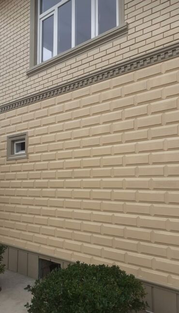 fasad boya renkleri: Kərpic görünüşlü fasad panelləri. Bu panellər binanın xarici