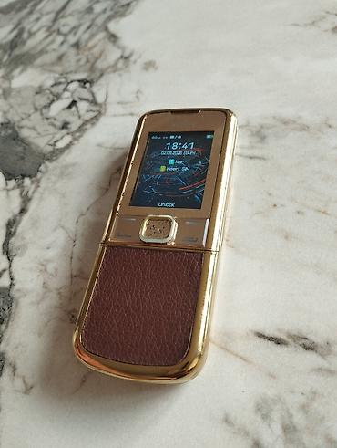 herbi telefon: Qızılı-rəng korpuslu, sürüşdürülən korpus dizaynlı düyməli mobil — 5