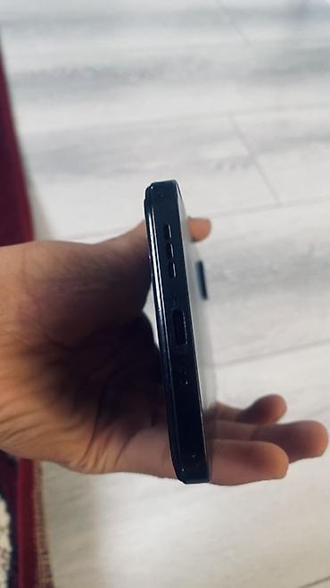 Мобильные телефоны: Смартфон Redmi 13C (модель на экране устройства), цвет черный — 4