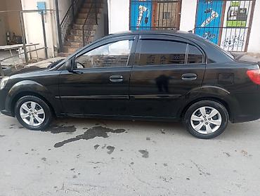 yan güzgülər s: Kia Rio: 1.4 l | 2010 il Sedan — 5