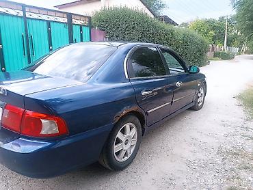 выбор номера о: Kia Magentis: 2003 г., 2 л, Механика, Бензин, Седан — 2