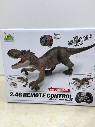 детская игрушка на кроватку: Динозавр на пульте управления "Раптор"