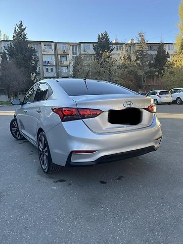 accent: Hyundai Accent sedan – gümüş rəng Əsas xüsusiyyətlər: - Kuzov: 4 — 4