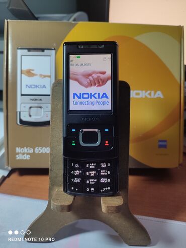 масажный ролик: Nokia 6700 Slide, Колдонулган, < 2 ГБ, түсү - Кара, 1 SIM