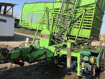 Кормоуборочные комбайны: Прицепной силосоуборочный/кормоуборочный подборщик-погрузчик Stoll — 1