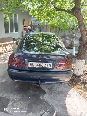 набор гирь для спорта: Автомобиль Mitsubishi Carisma, модель 1999 года, выполнен в кузове