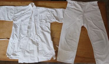 спортивный женский костюм: Кимоно белое для детей 
Для Каратэ Тэйквандо и Дзюдо