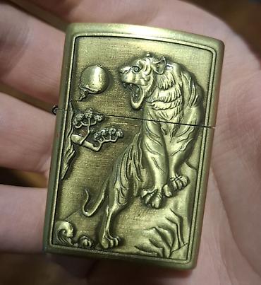 titan maqnit qolbaq: “XingLing Tiger Pələng Relyefli Metal Alışqan — 1