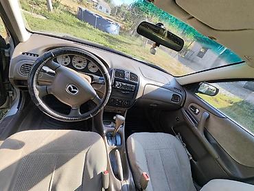 мата секыл: Mazda 323: 2000 г., 1.6 л, Автомат, Бензин, Седан — 5