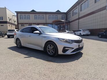 одиссей сатылат: Элегантный седан Kia Optima серебристого цвета, представленный на