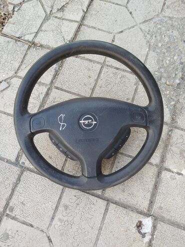 Yanacaq sistemləri: Opel avtomobilləri üçün nəzərdə tutulmuş qara rəngli sükan təkəri