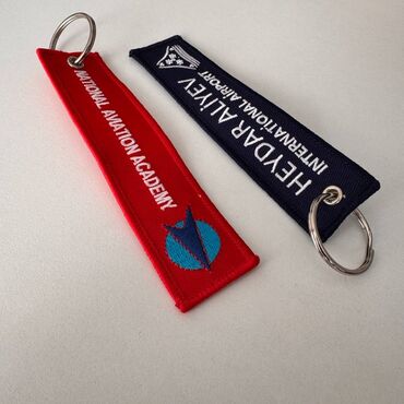 Breloklar: Продаю сувенирную ленту-брелок remove before flight с логотипом