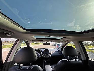panorama maşın: Hyundai Tucson: 0.2 l | 2009 il Krossover — 7
