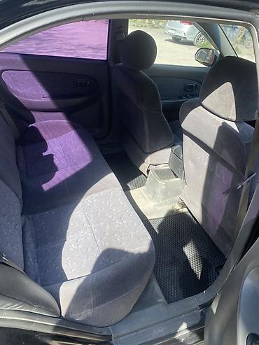 Другие автомобили: Седан компакт-класса, 4 двери, темно‑зеленый/черный цвет. Киргизские — 6