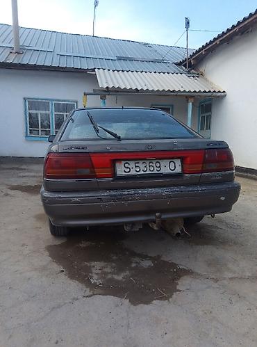 жак бу: Mazda 626: 1991 г., 2 л, Кол менен иштөөчү, Бензин, Хетчбек — 4