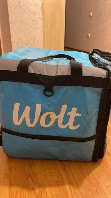 ПО для бизнеса: Wolt loqosu ilə bəzədilmiş, yemək çatdırılması üçün nəzərdə tutulmuş