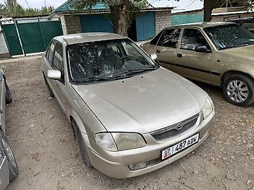 пленка авто: Mazda 323: 1998 г., Механика, Бензин, Седан — 2