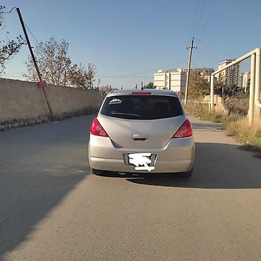 Nissan: Nissan Tiida: 1.5 l | 2004 il Hetçbek — 2